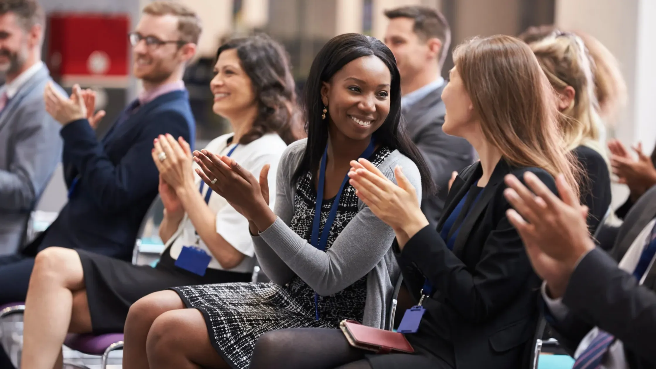 people clapping at conference