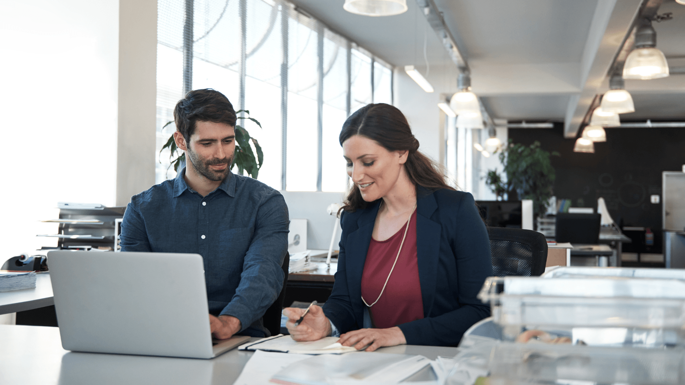 two people working at desk