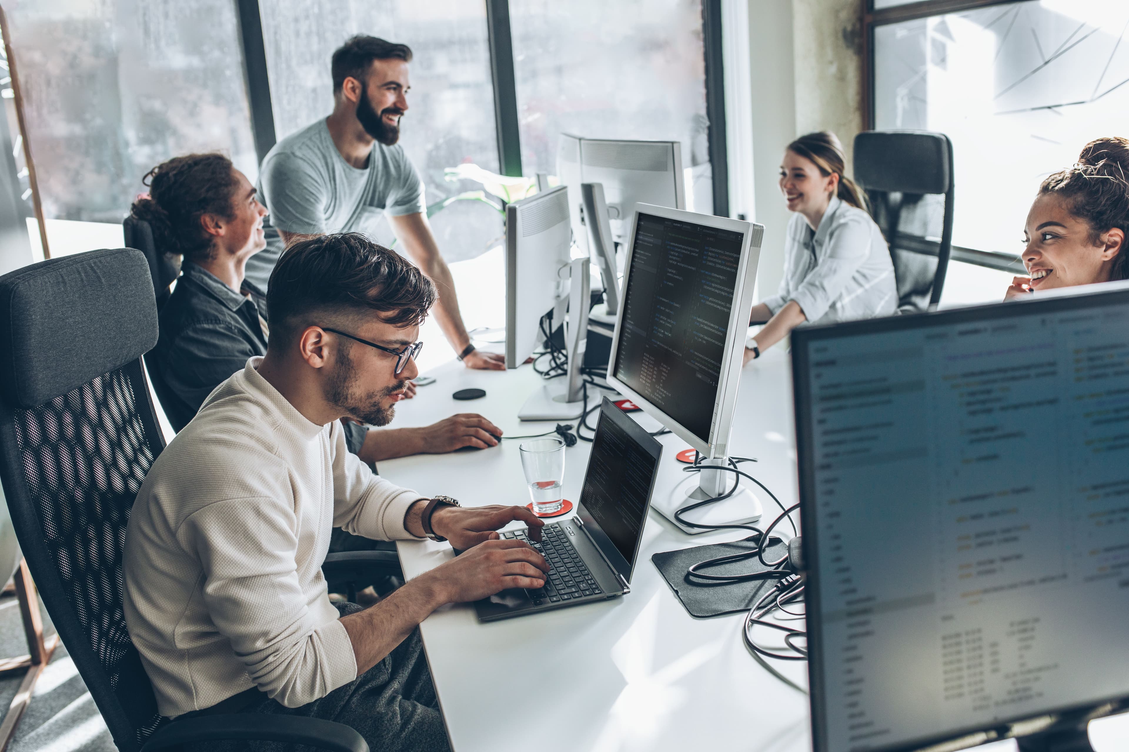 Technology consulting team collaborating on digital transformation strategy in modern office environment